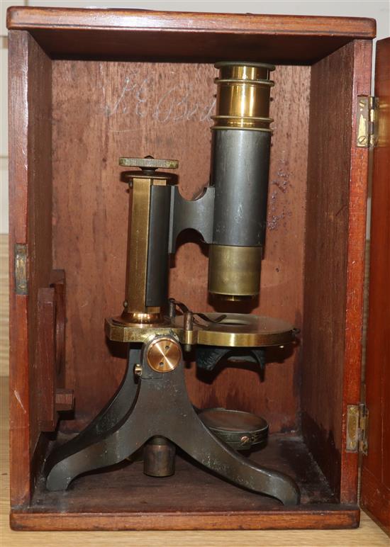 A cased brass microscope